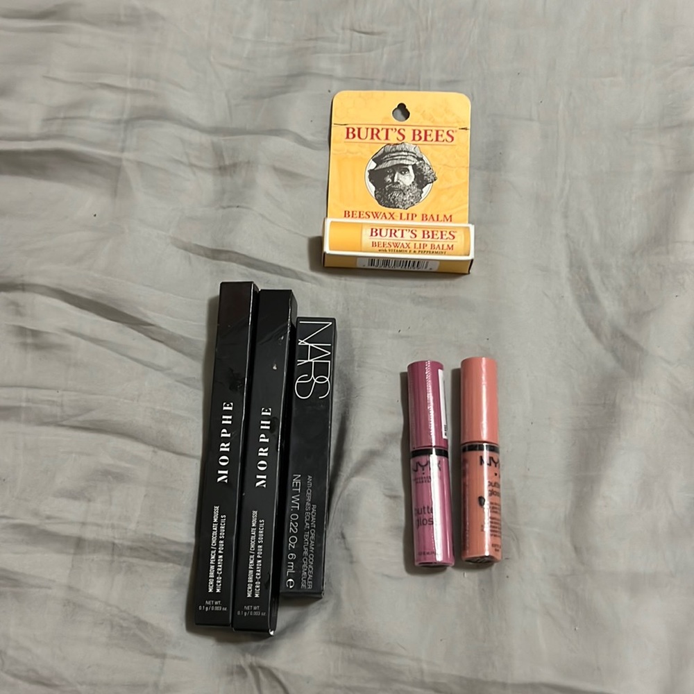 Unopened and unused brow pencils, concealer, lip balm, and lip gloss